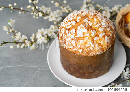 Easter cake with sugar powder on gray background 102694936