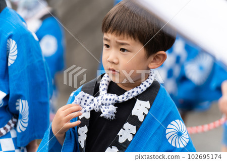 Children wearing festival happi coats 102695174