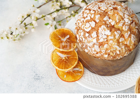 Easter cake with sugar powder on gray background Easter cake with sugar powder on gray background 102695388