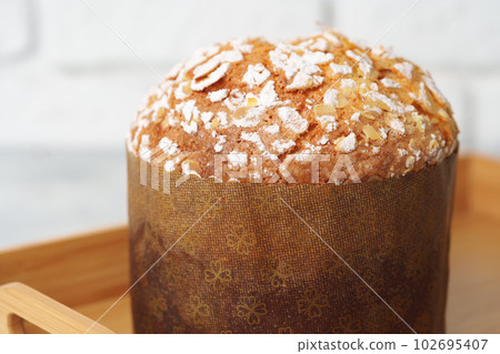 Easter cake with sugar powder on gray background Easter cake with sugar powder on gray background 102695407