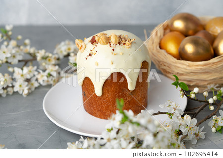 Traditional Easter cake with nuts on gray background Traditional Easter cake with nuts on gray background 102695414