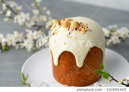 Traditional Easter cake with nuts on gray background Traditional Easter cake with nuts on gray background 102695449