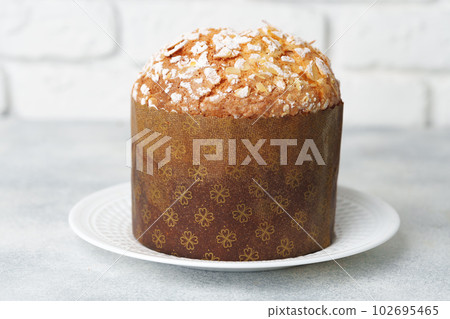 Easter cake with sugar powder on gray background Easter cake with sugar powder on gray background 102695465