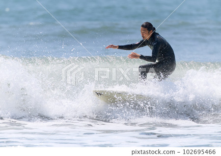 Active middle senior man enjoying surfing 102695466