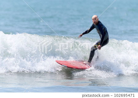 middle man enjoying surfing 102695471