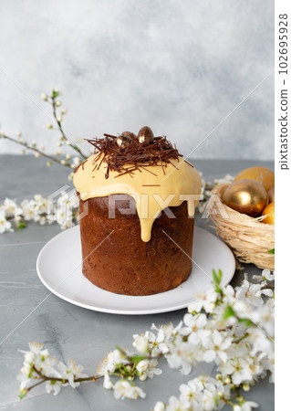 Easter cake with nest decor on gray background Easter cake with nest decor on gray background 102695928