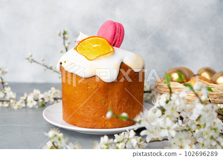 Beautiful Easter cake decorated with macarons cookie and dry orange piece 102696289