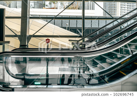 Interior of office center building with escalator 102696745