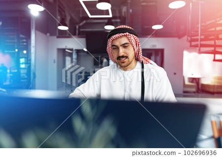 Young successful arab businessman working in the office Young successful arab businessman working in the office 102696936