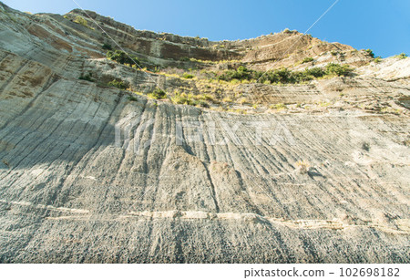 The textures of sandstone and past rugged cliffs on the coast to Cape Kidnappers in Hawke's Bay region of New Zealand. The textures of sandstone and past rugged cliffs on the coast to Cape Kidnappers in Hawke's Bay region of New Zealand. 102698182