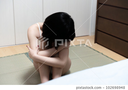 woman sitting in underwear woman sitting in underwear 102698948