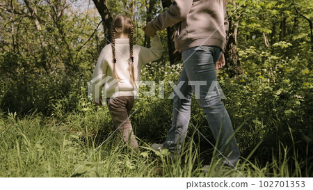 foot trail forest. mother child kid little girl. walk the feet of the forest. children's walk with a parent in the park. weekend vacation americans. chidhood dream. teamwork. pretty little girl. good. foot trail forest. mother child kid little girl. walk the feet of the forest. children's walk with a parent in the park. weekend vacation americans. chidhood dream. teamwork. pretty little girl. good. 102701353