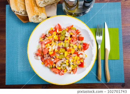 Appetizing salad with corn, olives and canned tuna 102701743