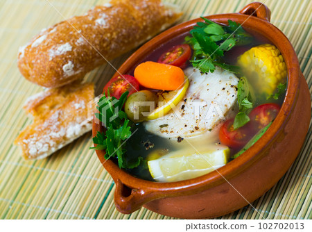 Fisherman's broth cooked with boiled pollock, carrots, corn and greens Fisherman's broth cooked with boiled pollock, carrots, corn and greens 102702013