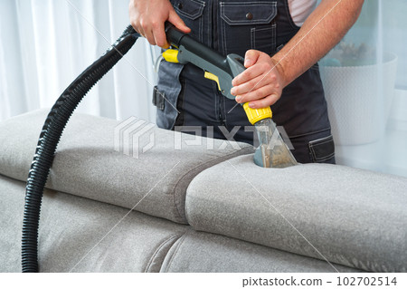 Sofa chemical cleaning with professionally extraction method. Wet textile sofa cleaning 102702514