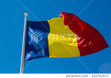 Romanian flag is fluttering in the wind Romanian flag is fluttering in the wind 102702873