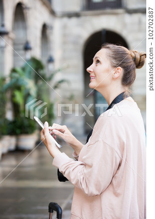 traveler examines the sights in the city traveler examines the sights in the city 102702887