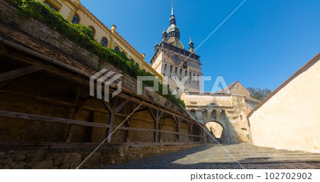 View of clock tower from fortress square in Sighisoara View of clock tower from fortress square in Sighisoara 102702902