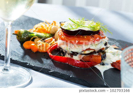 Fried eggplant and tomato pyramid 102703166