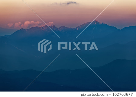 Mt. Kaikomagatake in the evening light seen from Mt. Kumazawa in the Central Alps Mt. Kaikomagatake in the evening light seen from Mt. Kumazawa in the Central Alps 102703677