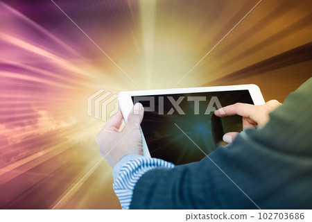 Female hands with tablet in sunlight 102703686