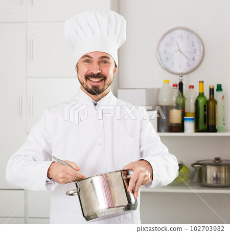 Male cook tasting food 102703982