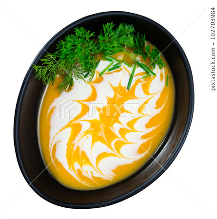 Cooked homemade tasty pumpkin and ginger cream soup in bowl 102703984