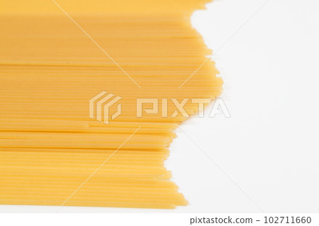Spaghetti spread out on a white surface. Spaghetti spread out on a white surface. 102711660