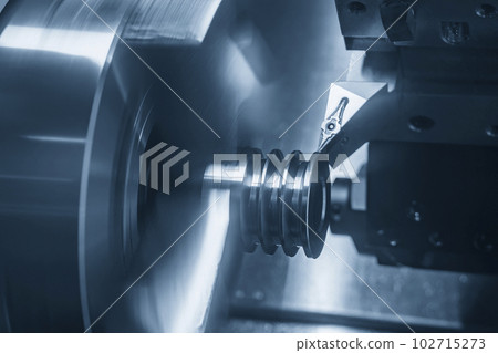 The  CNC lathe machine V-groove   cutting operation. 102715273
