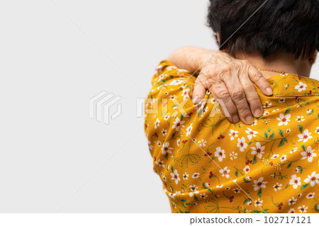 Sick senior woman with back neck and shoulders pain on the joint and muscle. Close-up of wrinkled hands rubbing their neck-collar area, osteoarthritis, neurological diseases. Medicine concept Sick senior woman with back neck and shoulders pain on the joint and muscle. Close-up of wrinkled hands rubbing their neck-collar area, osteoarthritis, neurological diseases. Medicine concept 102717121