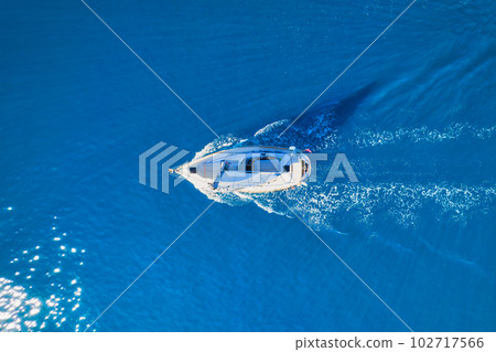 Wave and sail yacht on the sea as a background. .Sea and waves from top view. Blue water background 102717566