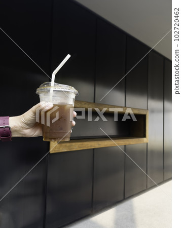 A glass of iced black orange coffee 102720462