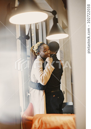 Two young people in cafe. African couple enjoying the time spending with each other. Two young people in cafe. African couple enjoying the time spending with each other. 102722038
