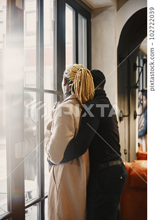Two young people in cafe. African couple enjoying the time spending with each other. Two young people in cafe. African couple enjoying the time spending with each other. 102722039