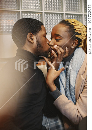 Two young people in cafe. African couple enjoying the time spending with each other. Two young people in cafe. African couple enjoying the time spending with each other. 102722073