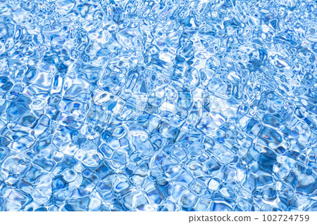 The surface of the water bathed in the sun and swaying in the wind The surface of the water bathed in the sun and swaying in the wind 102724759