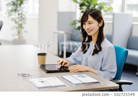 Business woman working in designer's office Business woman working in designer's office 102725549