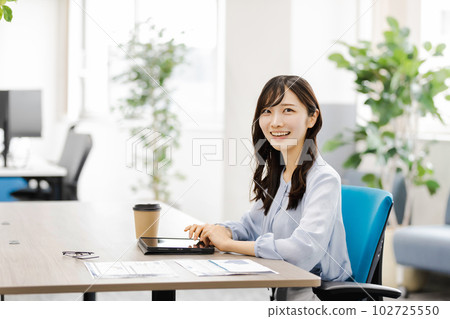 Business woman working in designer's office Business woman working in designer's office 102725550