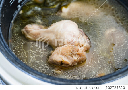 Chicken wing rice soup made in a rice cooker Chicken wing rice soup made in a rice cooker 102725820
