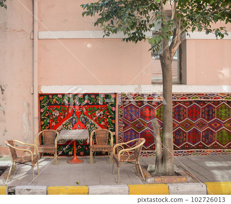 Beautiful street cafe in Turkey with colorful carpets. 102726013
