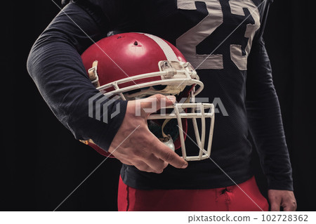 Football player on dark background Football player on dark background 102728362