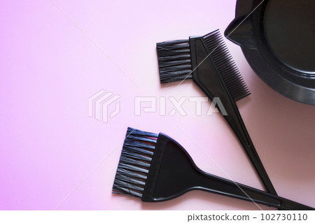 hairdressing brushes on pink background, hair coloring kit, beauty salon banner, pink background 102730110