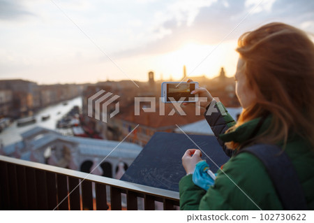 Beautiful woman having fun traveling outdoors during vacation in Europe. Lifestyle, travel concept. 102730622
