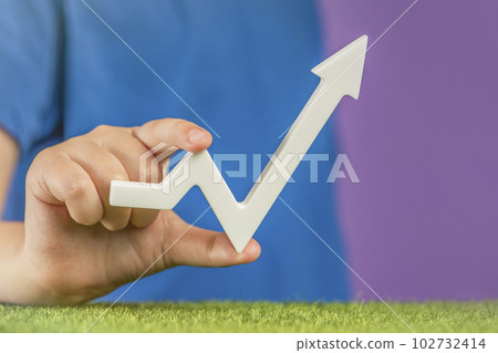 Economic recovery. Wage growth. Raising prices and interest rates. Population growth or any other increase. Banner with a graph arrow in hands on a purple background points up. 102732414