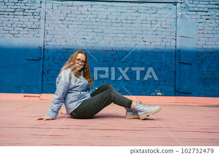 Portrait of a stylish woman in blue jacket Portrait of a stylish woman in blue jacket 102732479