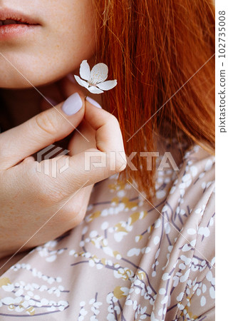 Young beautiful lady with rose on grey background. Skin care concept 102735008