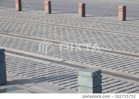 close-up of tram tracks, paved road, minimalism. close-up of tram tracks, paved road, minimalism. 102735732