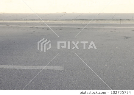 A street border painted in white , minimalism. A street border painted in white , minimalism. 102735754
