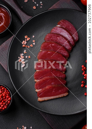 Delicious duck fillet smoked or grilled with spices and salt 102737906