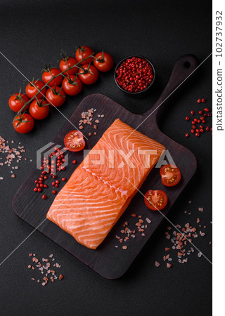 Fresh raw salmon red fish fillet with salt and spices 102737932